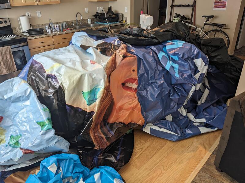 Large vinyl cover being assembled, covering my kitchen table